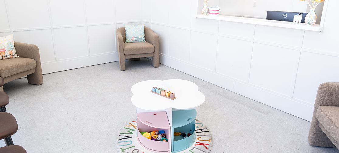 The colorful reception room showing chairs, armchairs and play area
